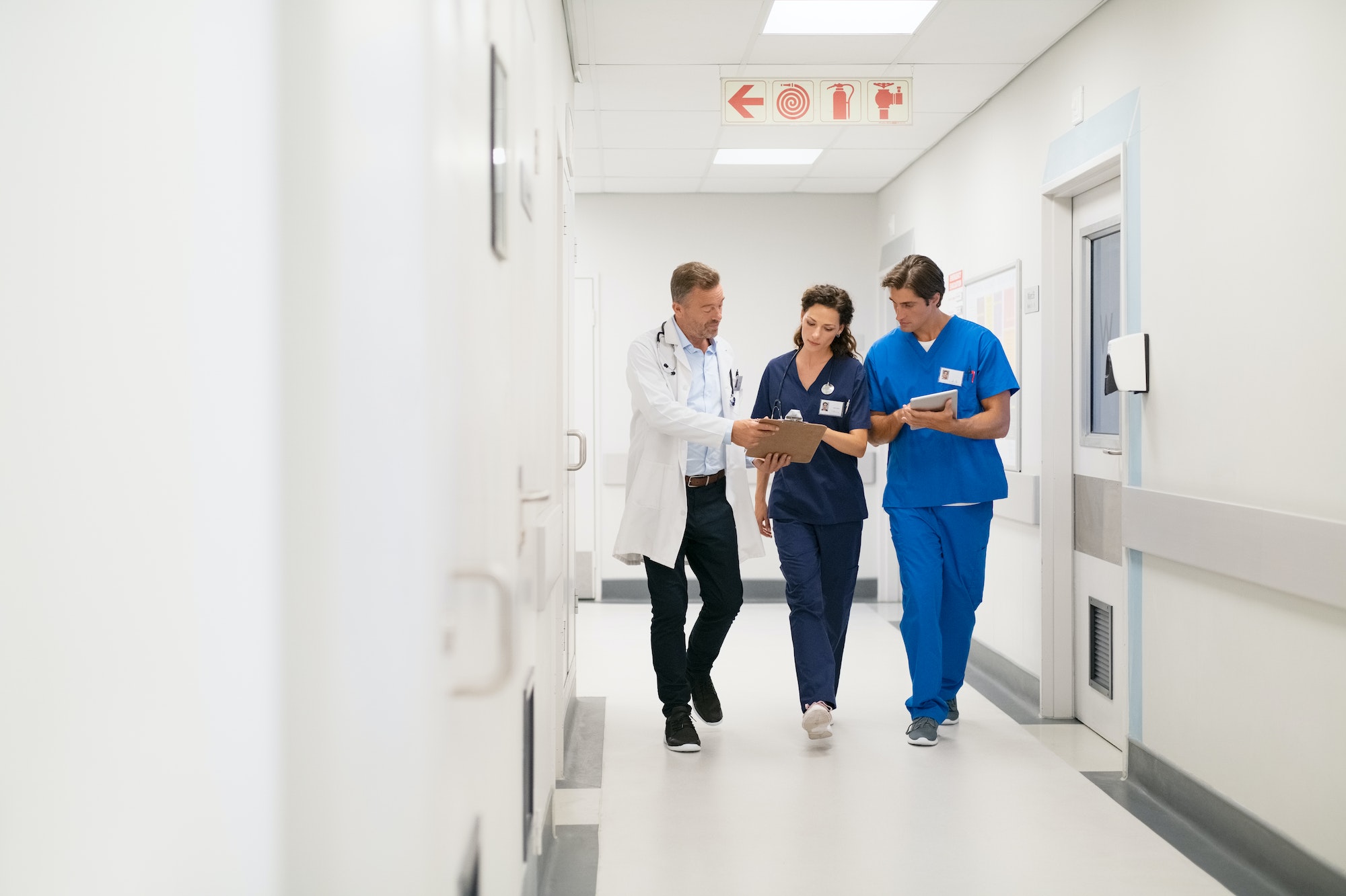 Medical staff discussing report at hospital